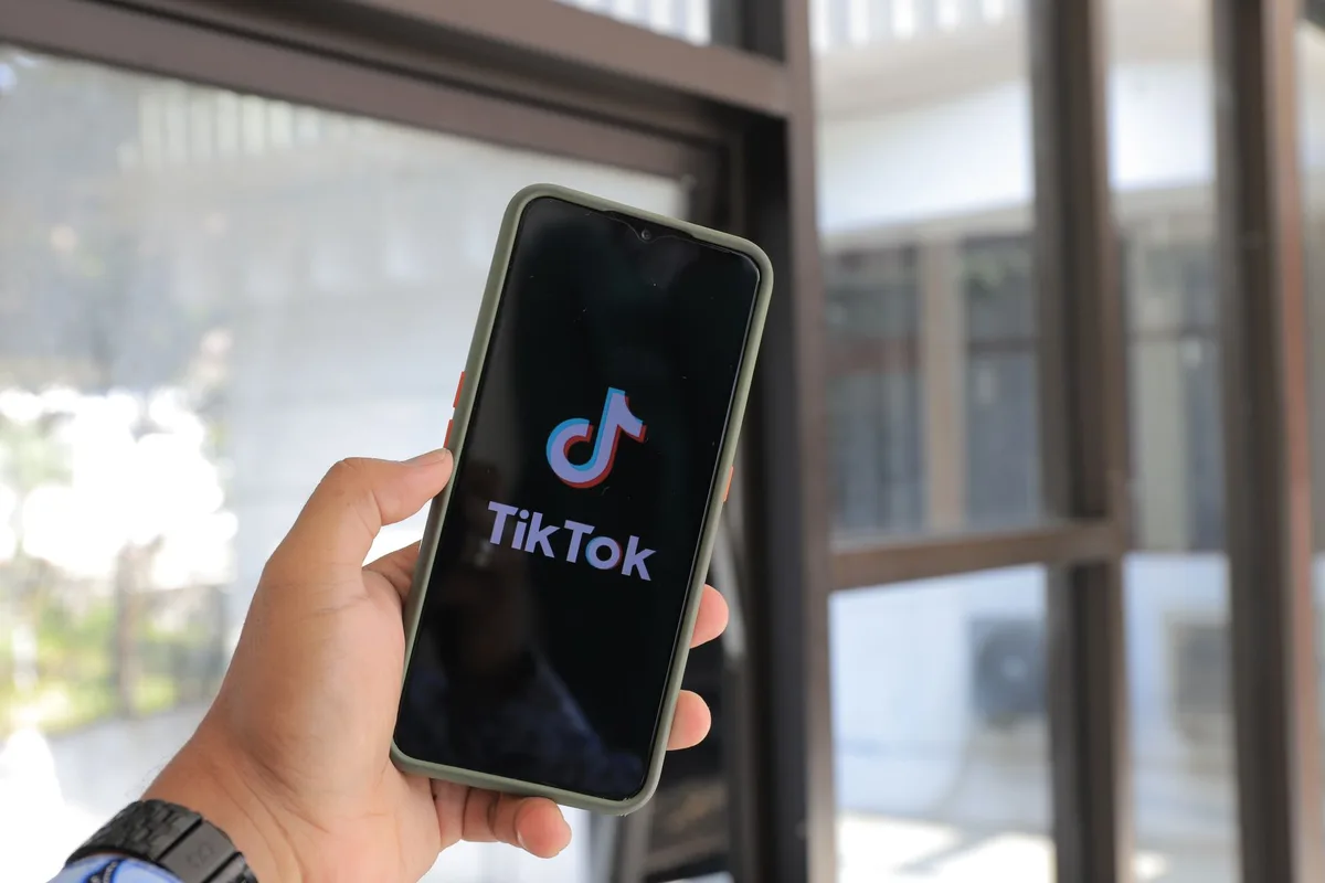 Person setting up a TikTok Shop seller account on a laptop in Indonesia