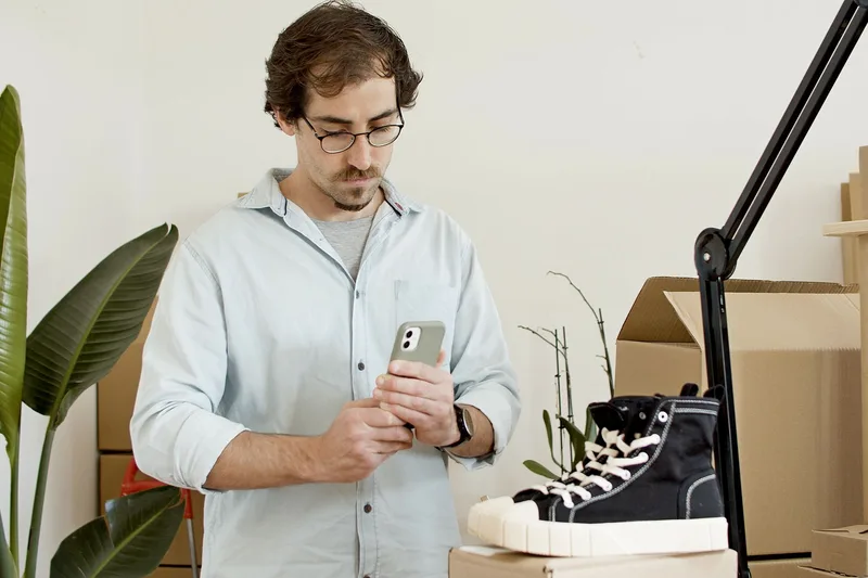 Person setting up a live streaming session using a smartphone